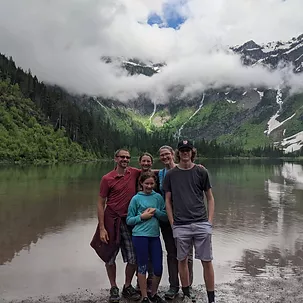 Daman and others outisde in front of a lake